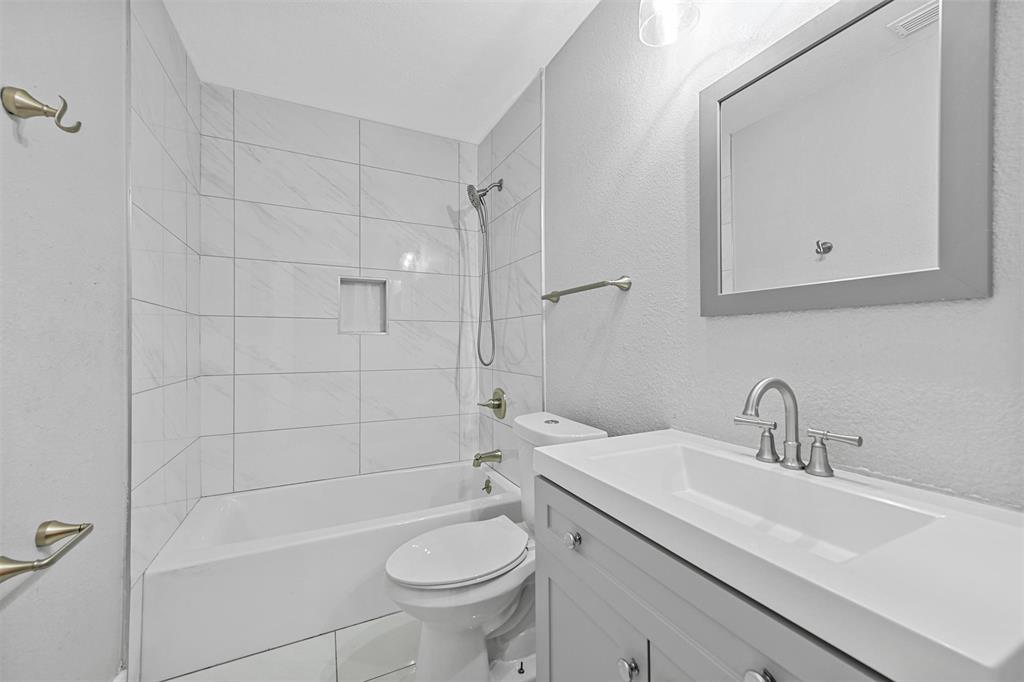 303 Riva Ridge Wylie, TX 75098 - Photo 28 of 38 a bathroom with a sink a toilet and shower