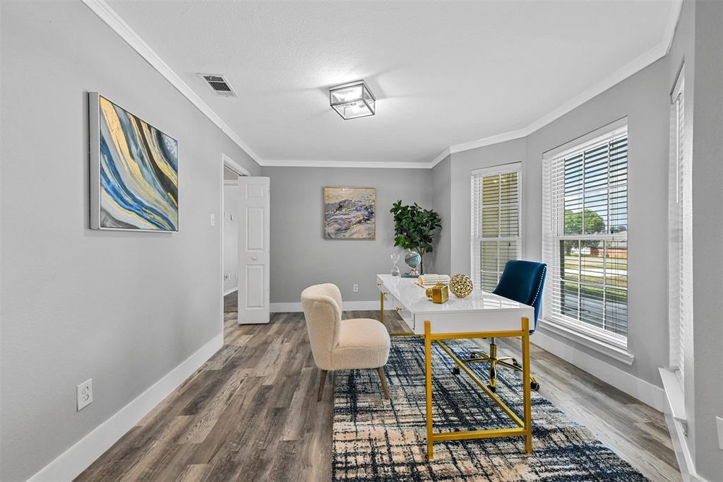 303 Riva Ridge Wylie, TX 75098 - Photo 30 of 38 a view of a dining room with furniture a rug and wooden floor