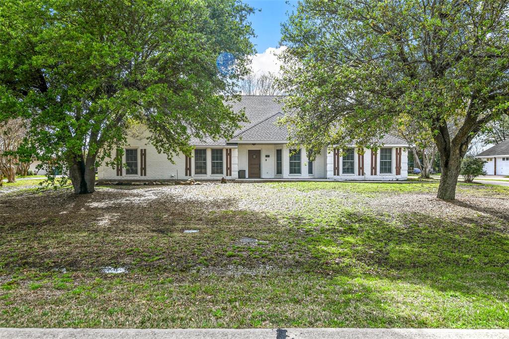 303 Riva Ridge Wylie, TX 75098 - Photo 3 of 38 a front view of a house with a garden