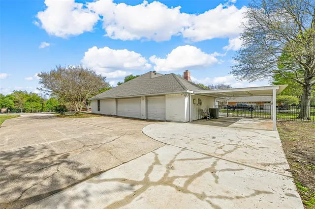 a view of a house with a yard and garage