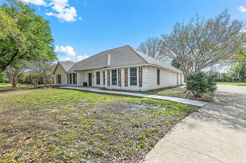 303 Riva Ridge Wylie, TX 75098 - Photo 4 of 38 a house with trees in the background