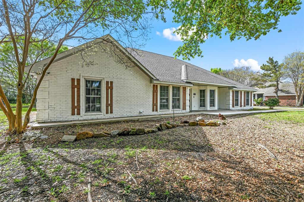 303 Riva Ridge Wylie, TX 75098 - Photo 5 of 38 a house with trees in the background