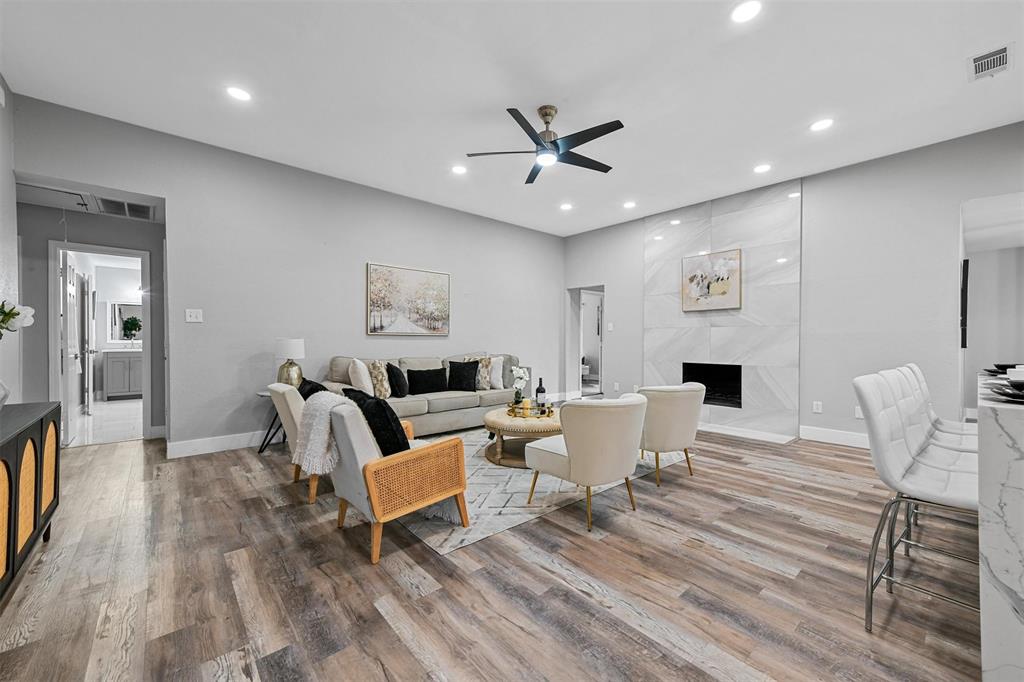 303 Riva Ridge Wylie, TX 75098 - Photo 6 of 38 a living room with furniture a window and a chandelier