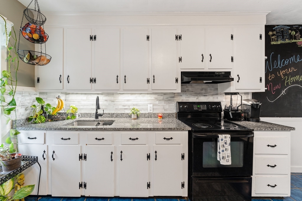 185 West Avenue Pawtucket, RI 02860 - Photo 20 of 40 a kitchen with stainless steel appliances granite countertop a stove a cabinets and a counter