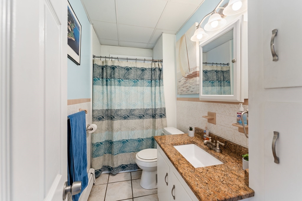 185 West Avenue Pawtucket, RI 02860 - Photo 26 of 40 a bathroom with a granite countertop sink toilet and shower
