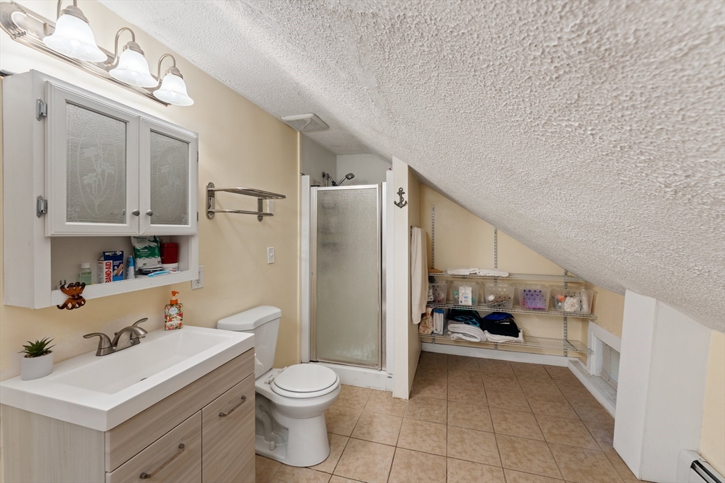 185 West Avenue Pawtucket, RI 02860 - Photo 30 of 40 a bathroom with a sink toilet and shower