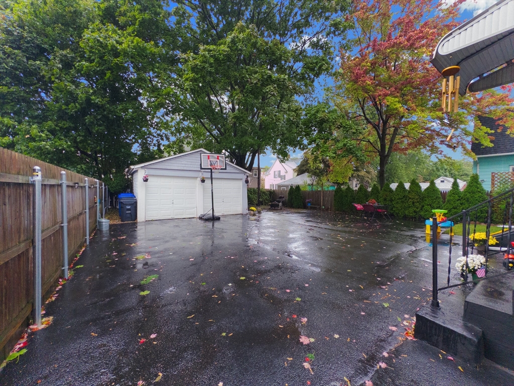 185 West Avenue Pawtucket, RI 02860 - Photo 3 of 40 a backyard of a house with barbeque oven and outdoor seating