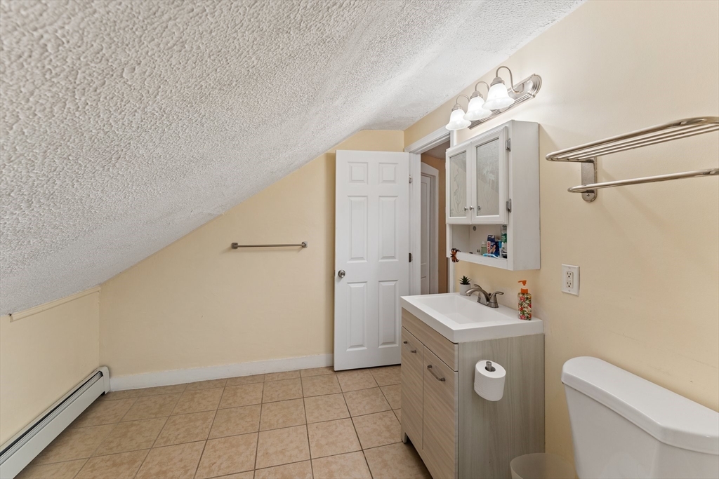 185 West Avenue Pawtucket, RI 02860 - Photo 31 of 40 a bathroom with a sink a toilet and shower
