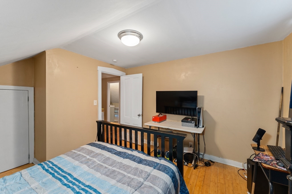 185 West Avenue Pawtucket, RI 02860 - Photo 33 of 40 a bedroom with a bed and a flat screen tv
