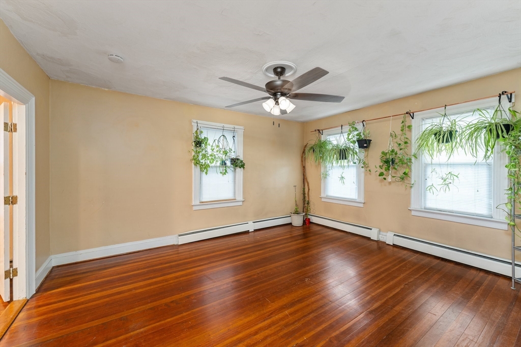 185 West Avenue Pawtucket, RI 02860 - Photo 9 of 40 a view of an empty room with wooden floor and a window