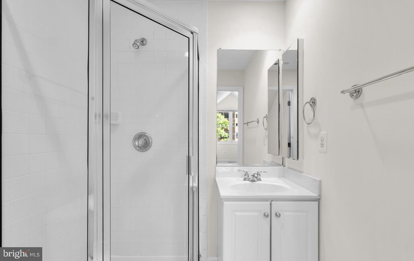 8509 2nd Avenue Silver Spring, MD 20910 - Photo 11 of 16 a bathroom with a shower sink and mirror