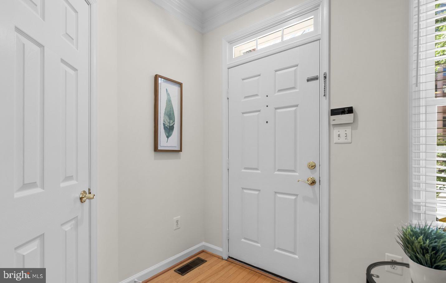 8509 2nd Avenue Silver Spring, MD 20910 - Photo 12 of 16 a view of a hallway with wooden floor and closet area