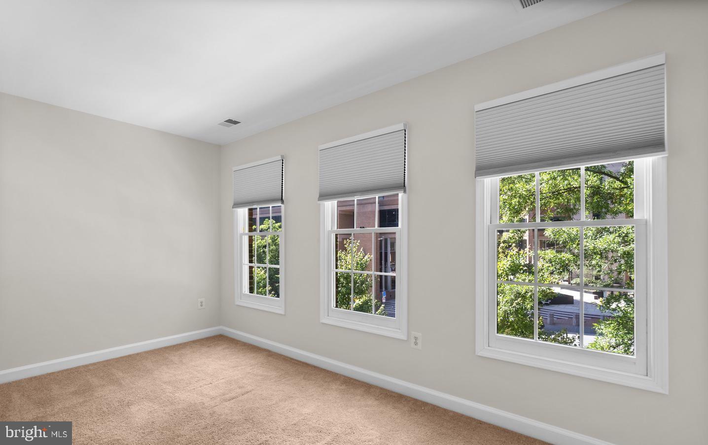 8509 2nd Avenue Silver Spring, MD 20910 - Photo 13 of 16 a view of an empty room with a window