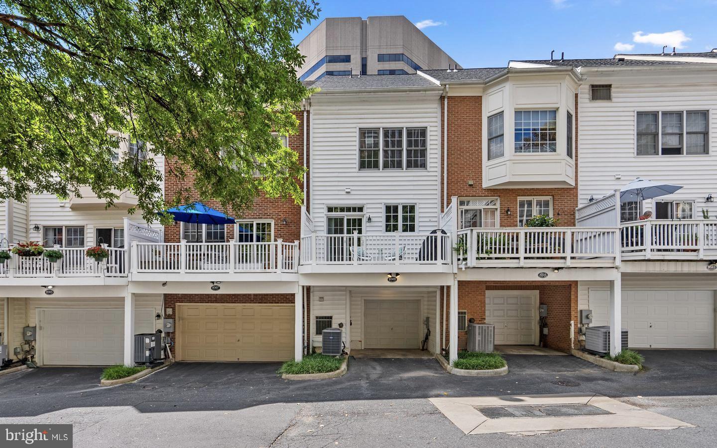 8509 2nd Avenue Silver Spring, MD 20910 - Photo 2 of 16 a front view of a building with a garden