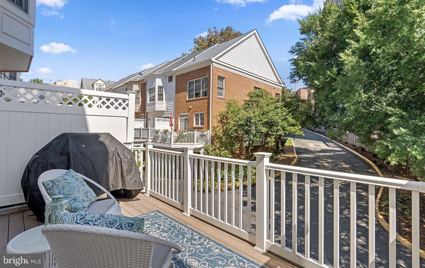 8509 2nd Avenue Silver Spring, MD 20910 - Photo 8 of 16 a view of a chairs and table in the balcony