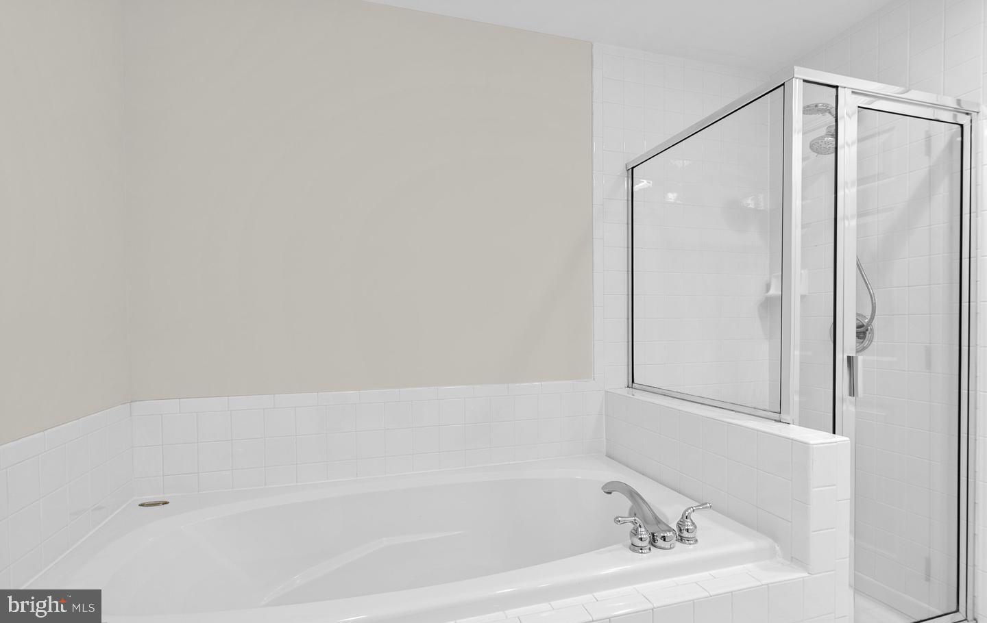 8509 2nd Avenue Silver Spring, MD 20910 - Photo 10 of 16 a bathroom with a bathtub and a shower