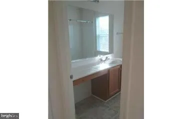 a bathroom with a sink and mirror