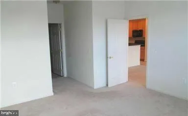 a view of an empty room and a window