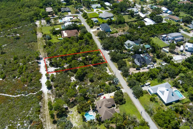 an aerial view of residential house with yard and outdoor space