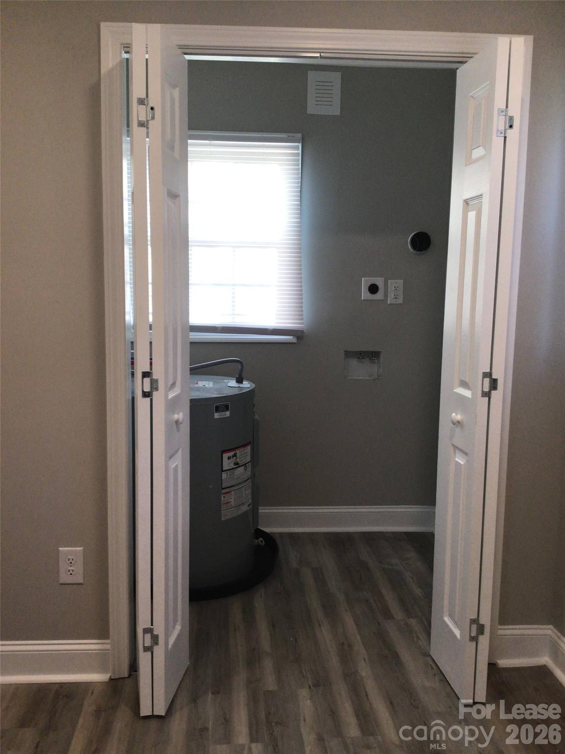 816 Margrace Road Kings Mountain, NC 28086 - Photo 12 of 13 a view of an empty room with wooden floor and a window