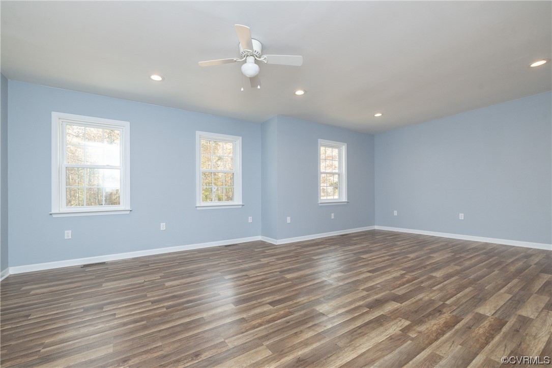 2252 Cedar Hill Road Mineral, VA 23117 - Photo 11 of 35 an empty room with wooden floor and windows