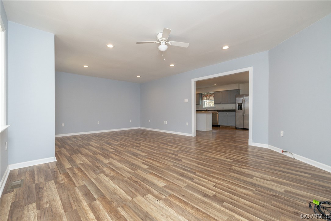 2252 Cedar Hill Road Mineral, VA 23117 - Photo 12 of 35 a view of empty room with wooden floor and kitchen