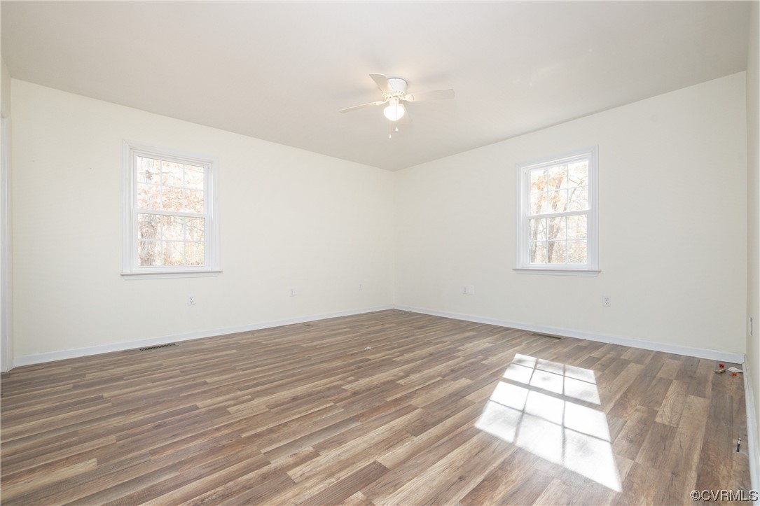 2252 Cedar Hill Road Mineral, VA 23117 - Photo 15 of 35 wooden floor in an empty room with a window