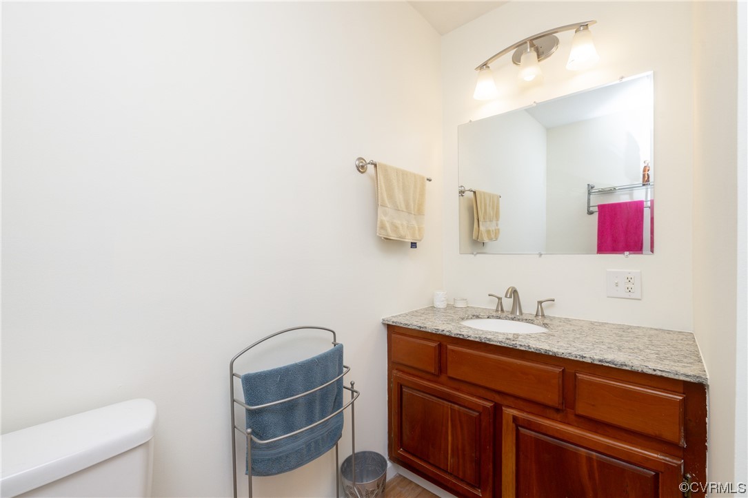 2252 Cedar Hill Road Mineral, VA 23117 - Photo 16 of 35 a bathroom with a granite countertop sink and a mirror