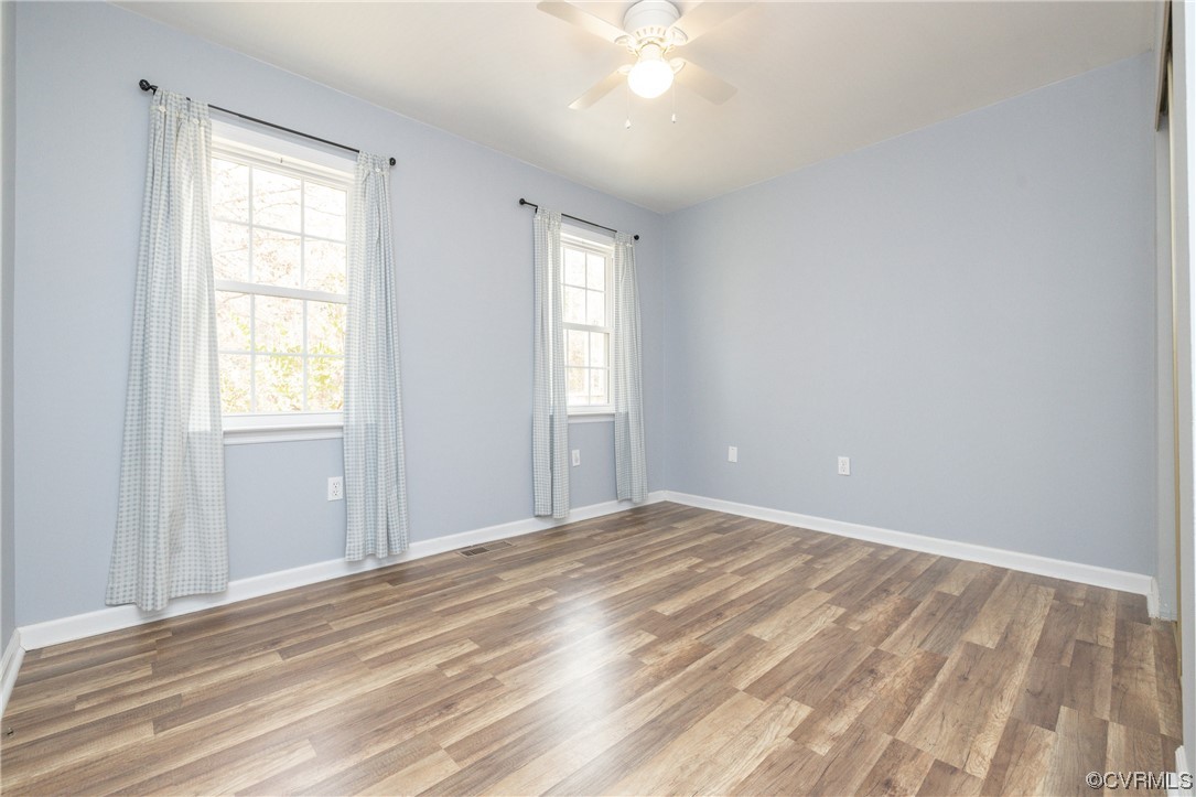 2252 Cedar Hill Road Mineral, VA 23117 - Photo 18 of 35 a view of an empty room with wooden floor and a window