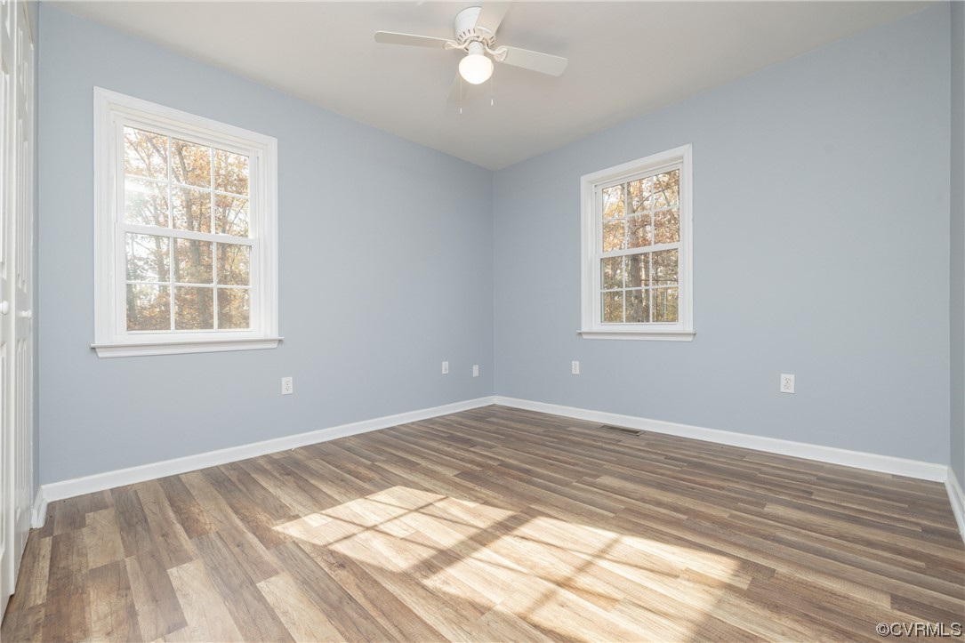 2252 Cedar Hill Road Mineral, VA 23117 - Photo 21 of 35 a view of an empty room with wooden floor and a window
