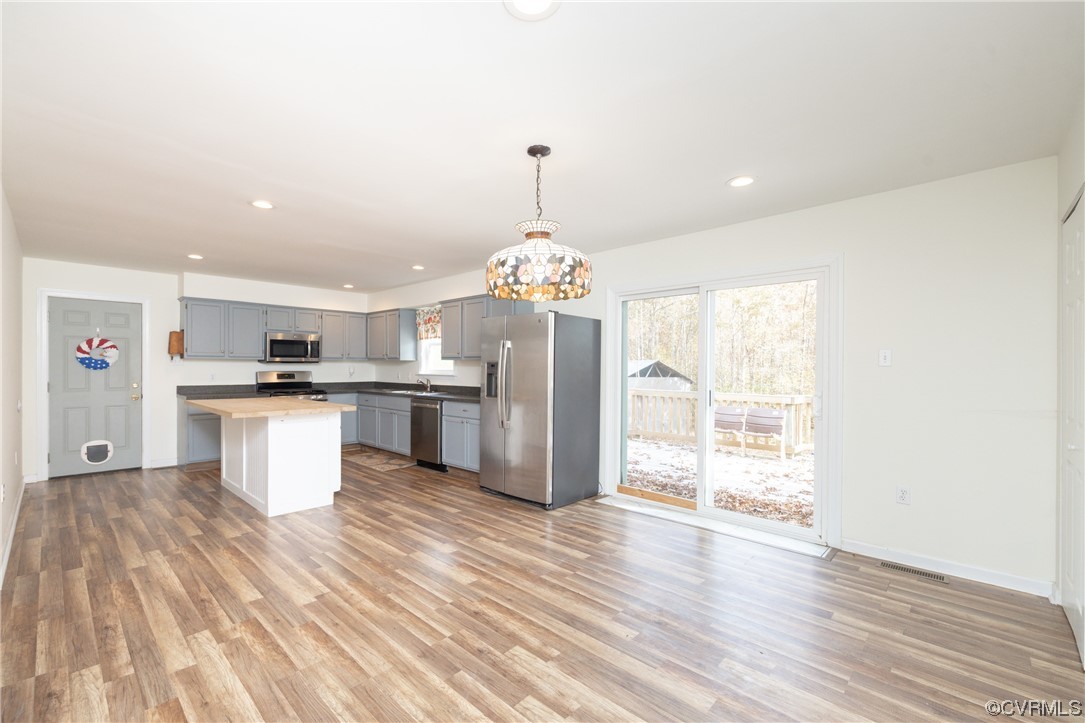 2252 Cedar Hill Road Mineral, VA 23117 - Photo 3 of 35 a kitchen with a refrigerator and wooden floor