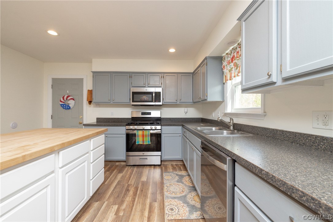 2252 Cedar Hill Road Mineral, VA 23117 - Photo 7 of 35 a kitchen with granite countertop a sink stainless steel appliances and cabinets