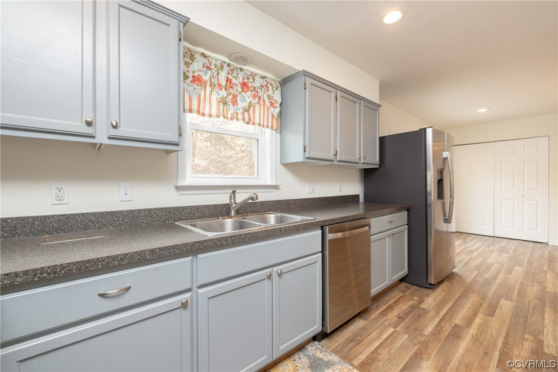 2252 Cedar Hill Road Mineral, VA 23117 - Photo 9 of 35 a kitchen with stainless steel appliances granite countertop a sink dishwasher a refrigerator and cabinets with wooden floor