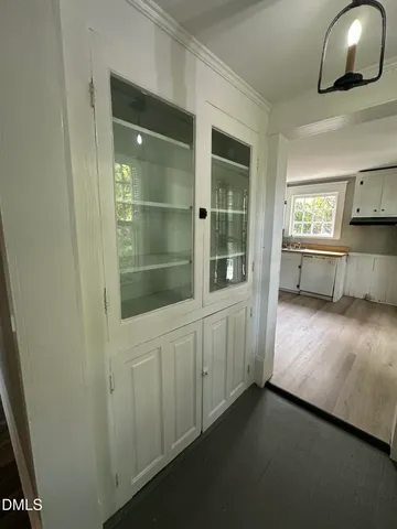 a view of a kitchen with a sink cabinets and a window