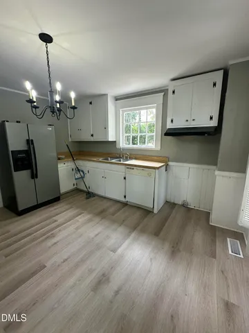 a room with furniture and wooden floor