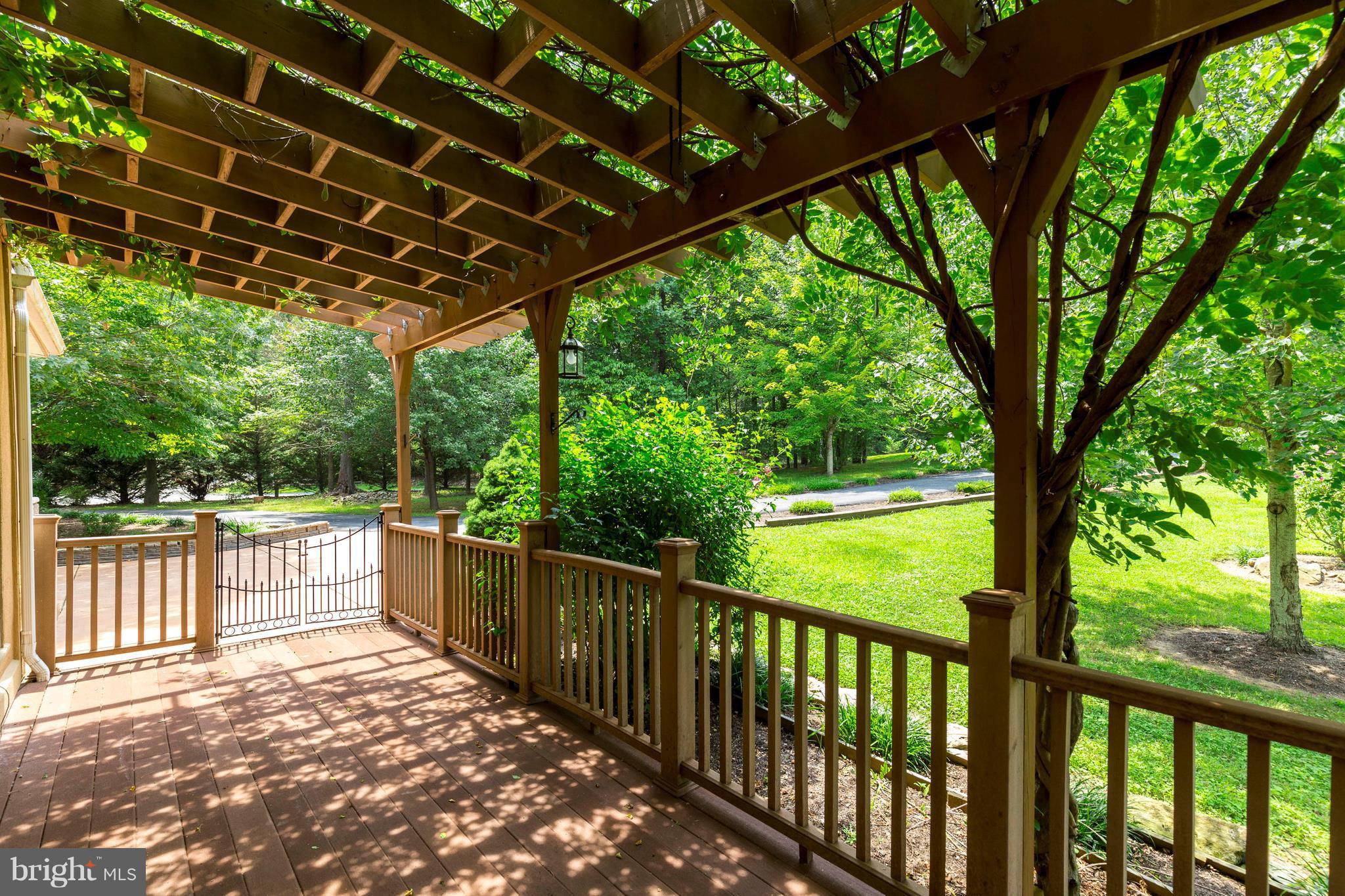10242 Cliff Mills Road Marshall, VA 20115 - Photo 3 of 30 a view of a porch with wooden floor and outdoor space