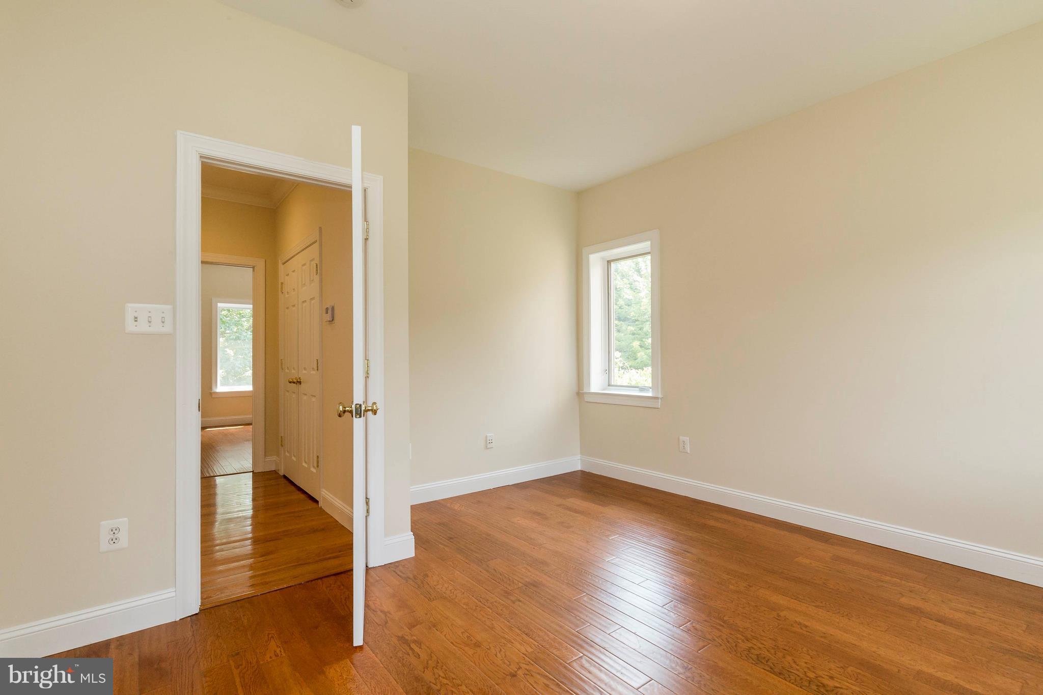 10242 Cliff Mills Road Marshall, VA 20115 - Photo 23 of 30 an empty room with wooden floor and a window