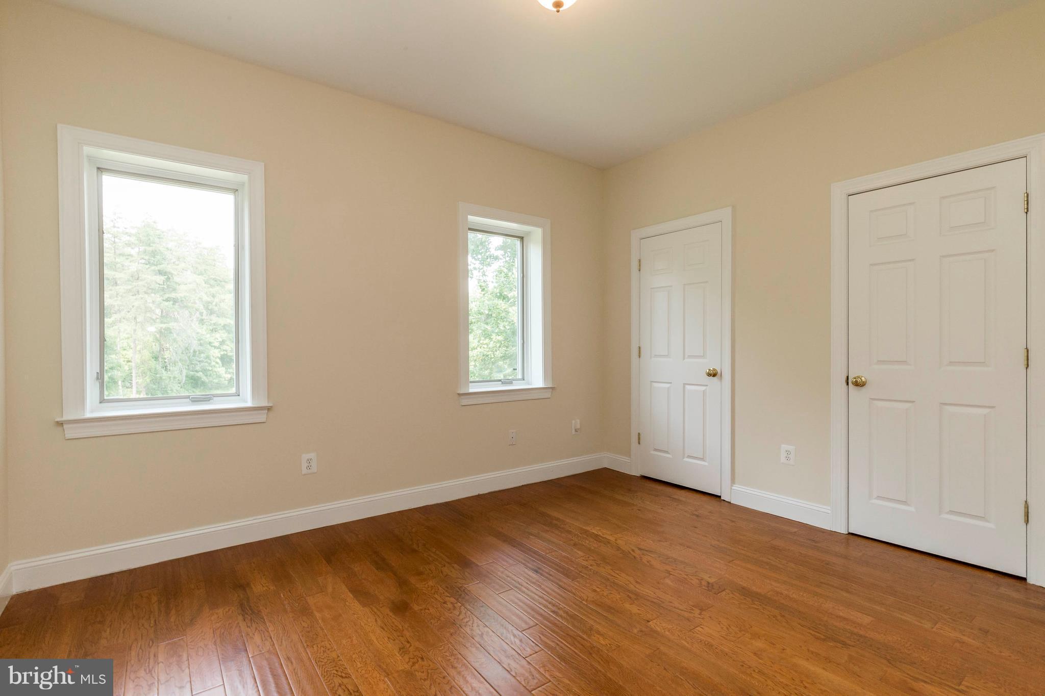 10242 Cliff Mills Road Marshall, VA 20115 - Photo 24 of 30 a view of an empty room with wooden floor and a window
