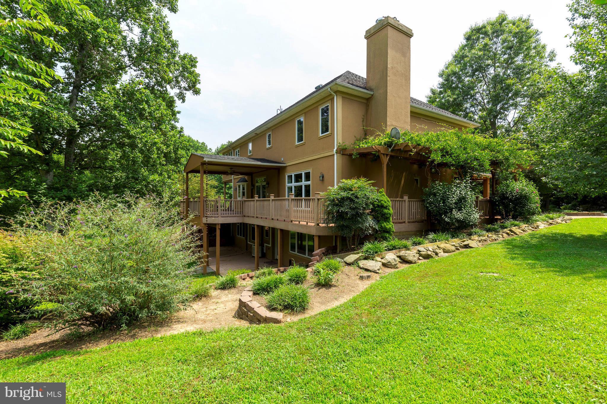 10242 Cliff Mills Road Marshall, VA 20115 - Photo 28 of 30 a front view of a house with a yard table and chairs