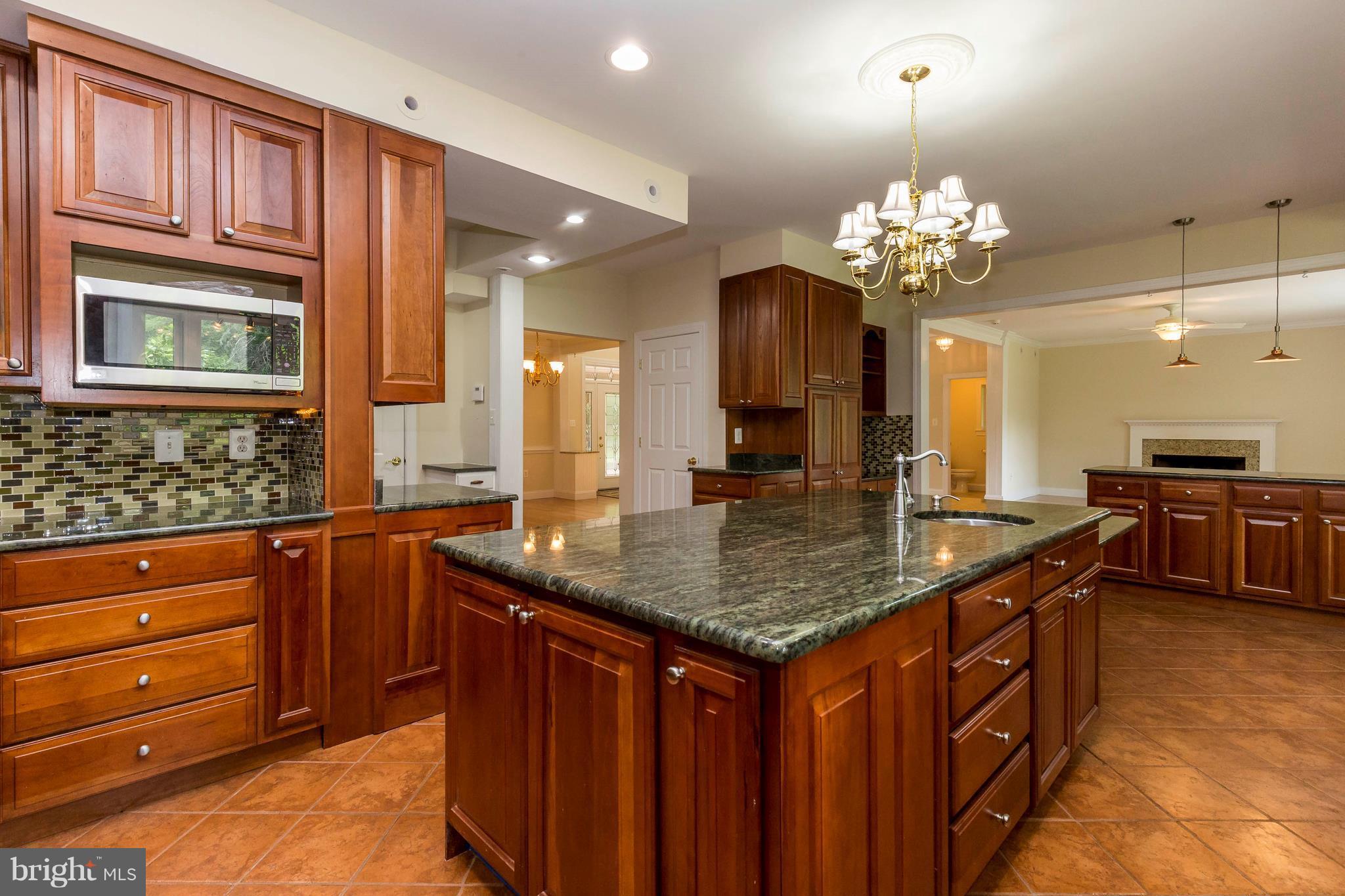10242 Cliff Mills Road Marshall, VA 20115 - Photo 8 of 30 a kitchen with a counter space a sink and cabinets