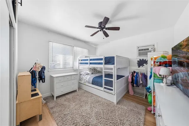 a bathroom with a sink toilet vanity and shower