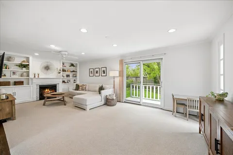 a spacious bedroom with furniture and a fireplace