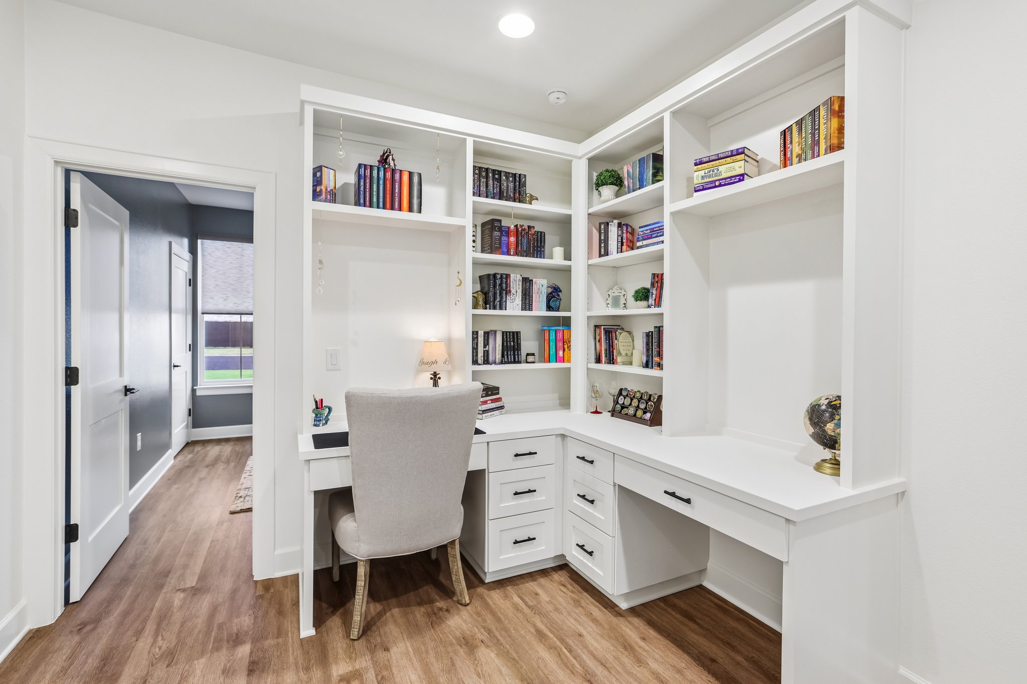 113 Crystal Lane Georgetown, TX 78633 - Photo 24 of 32 Built-in shelving and desk create a functional and stylish home office space.