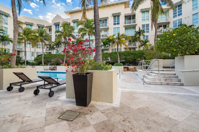 a view of a patio with a table and chairs