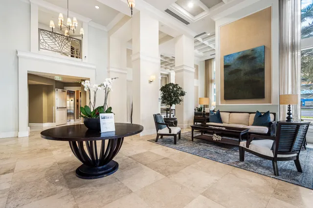 a dining room with furniture a livingroom and chandelier