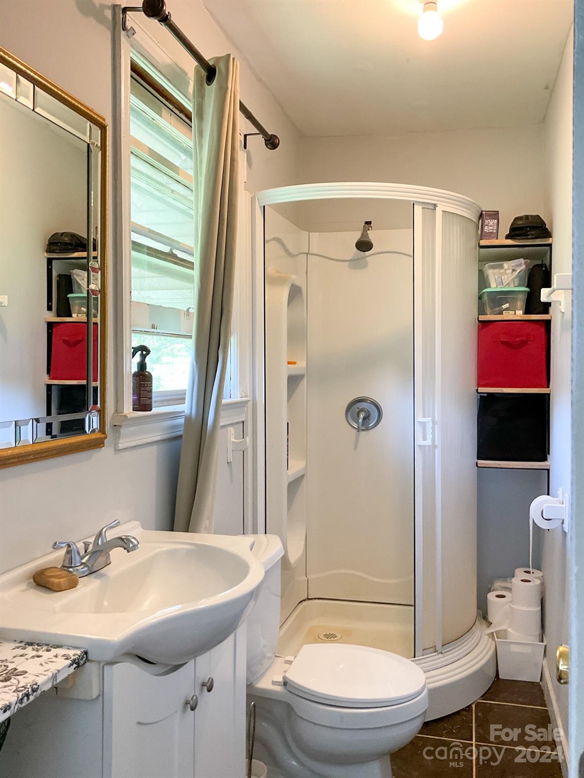 131 State Rd S-42-742 Wellford, SC 29385 - Photo 17 of 38 a bathroom with a sink a toilet and shower