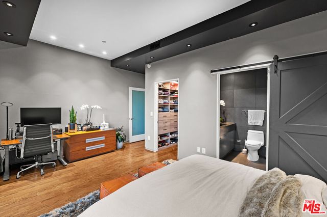 a bedroom with a bed and furniture