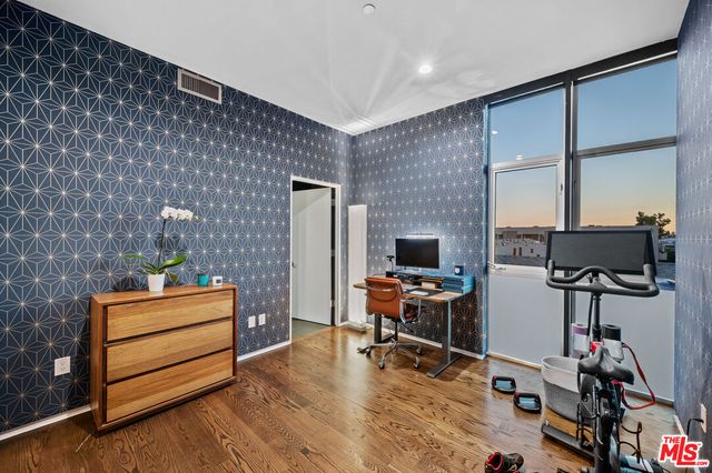 a room with furniture and wooden floor
