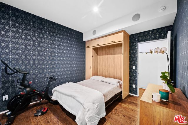 a bedroom with a bed and a table in it