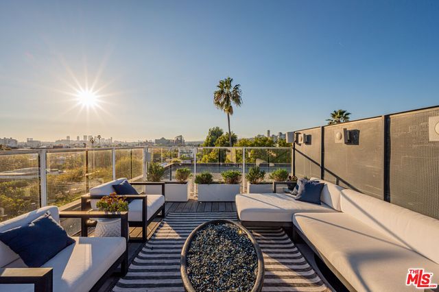 a view of a balcony with chairs
